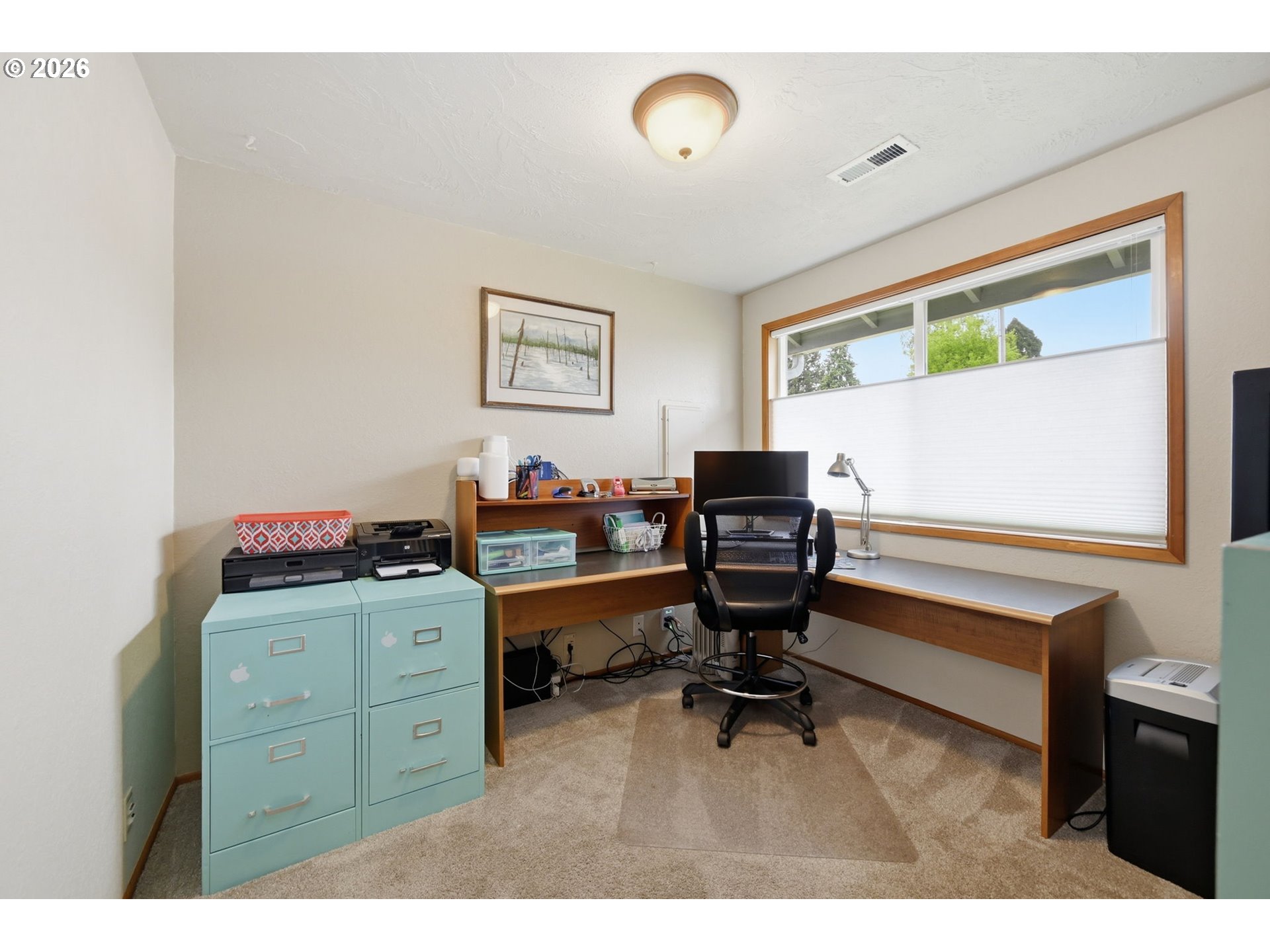 430 South 37th Place Springfield, OR 97478 - Photo 28 of 39 a room with a desk and chair with wooden floor