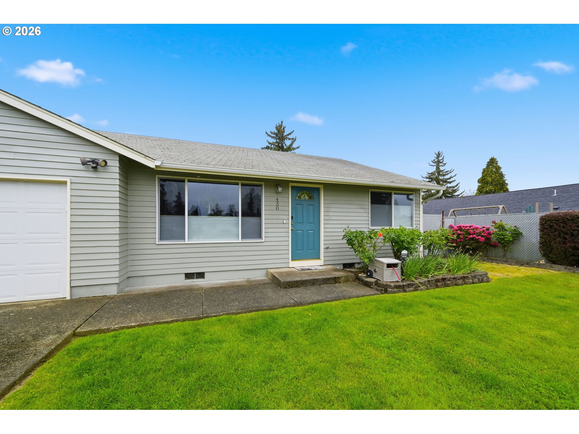 430 South 37th Place Springfield, OR 97478 - Photo 3 of 39 a view of a house with backyard sitting area and garden