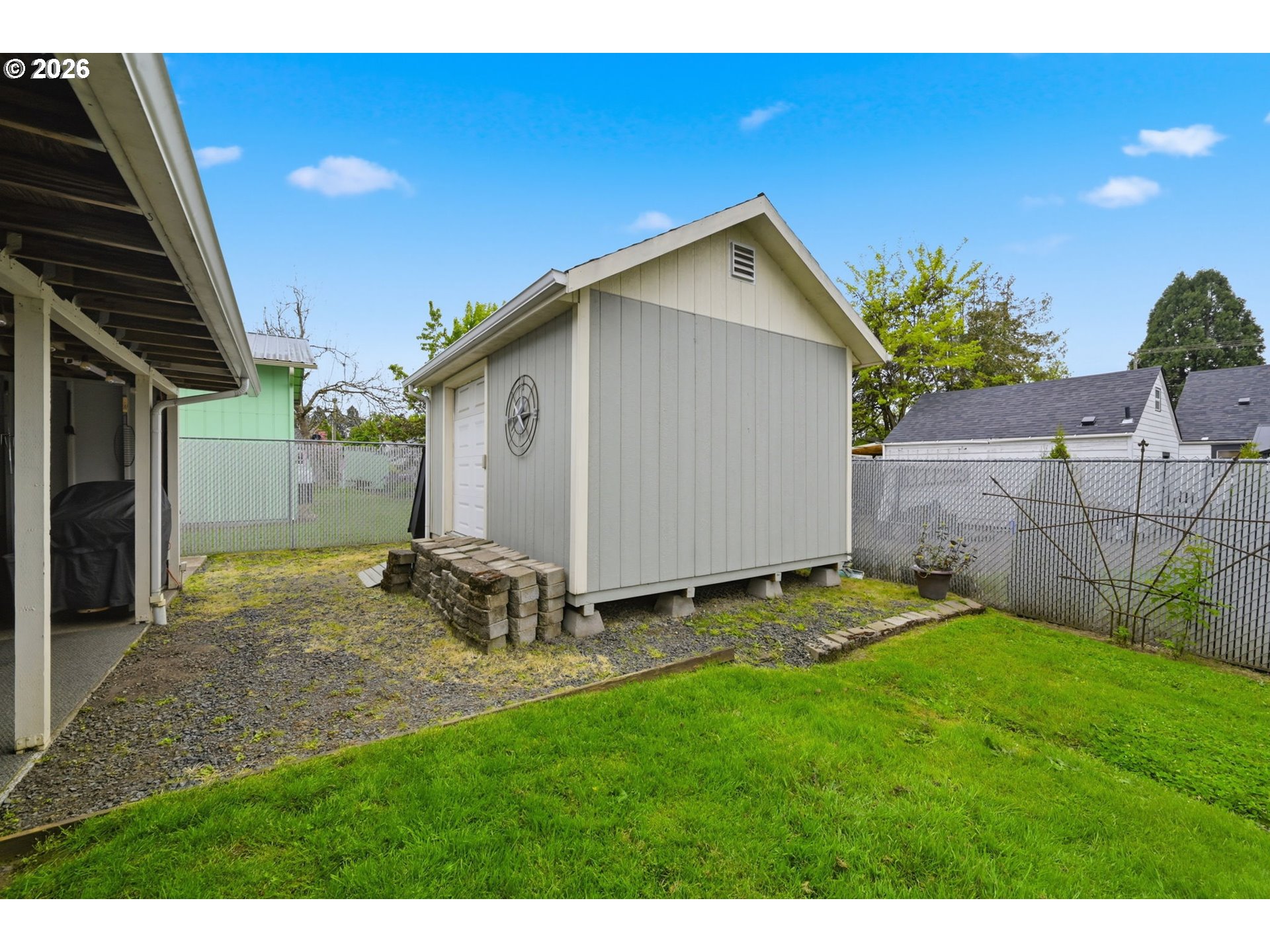 430 South 37th Place Springfield, OR 97478 - Photo 34 of 39 a backyard of a house with table and chairs