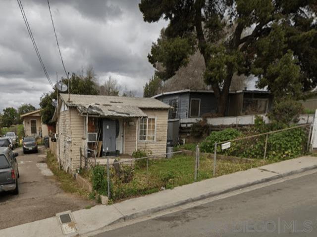 2743 Ridgeway Drive National City, CA 91950 - Photo 14 of 15 a front view of a house with a yard