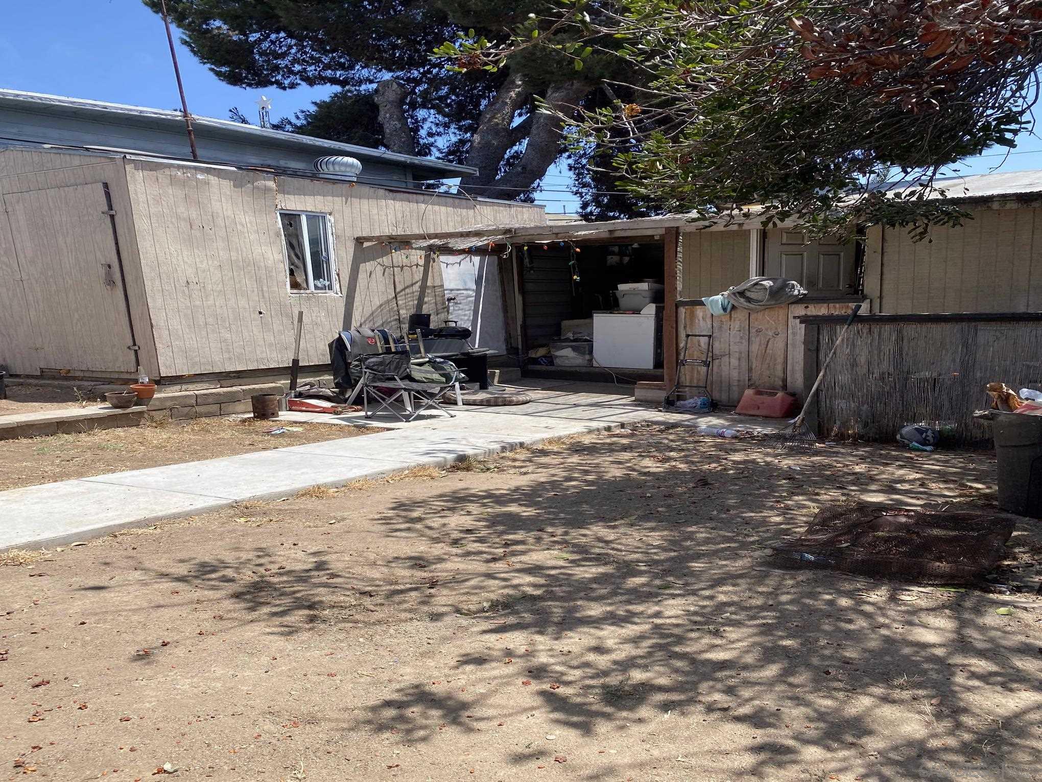 2743 Ridgeway Drive National City, CA 91950 - Photo 10 of 15 a view of a house with backyard and wooden fence