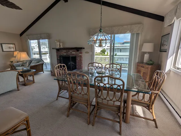 a dining room with furniture and chandelier kitchen view