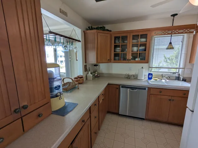 a kitchen with a refrigerator stove and cabinets