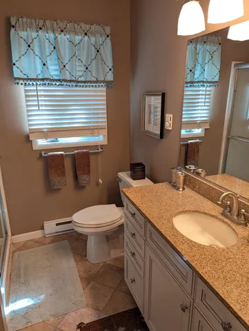 a bedroom with furniture and a chandelier