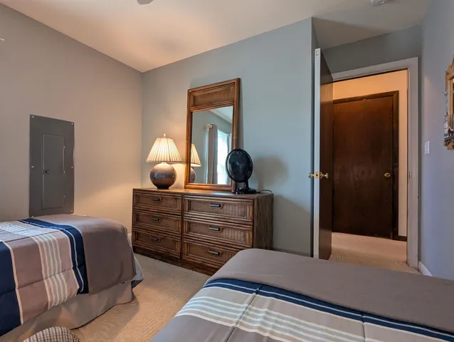 a living room with furniture a flat screen tv and a window