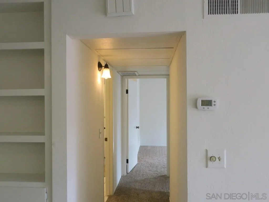 5938 Rancho Mission Road, Unit 134 San Diego, CA 92108 - Photo 12 of 36 a view of a hallway with a elevator