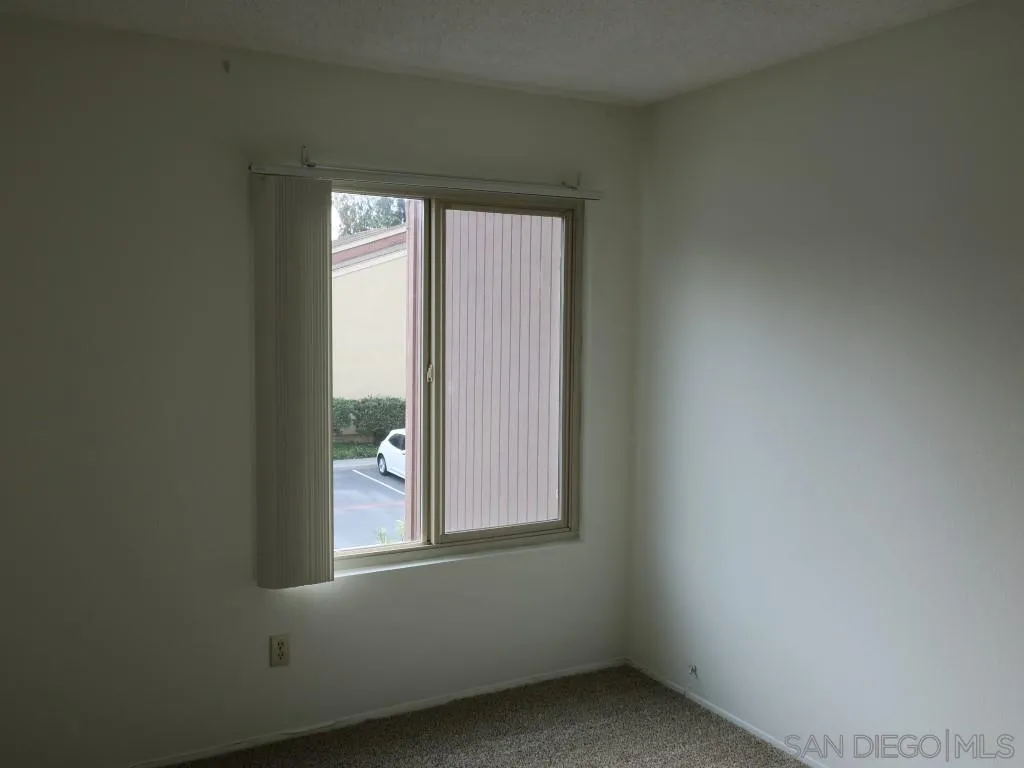 5938 Rancho Mission Road, Unit 134 San Diego, CA 92108 - Photo 13 of 36 an empty room with window