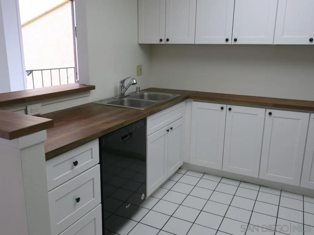 5938 Rancho Mission Road, Unit 134 San Diego, CA 92108 - Photo 2 of 36 a kitchen with a sink and cabinets