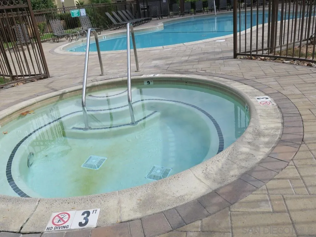 5938 Rancho Mission Road, Unit 134 San Diego, CA 92108 - Photo 26 of 36 a view of a swimming pool with a outdoor seating