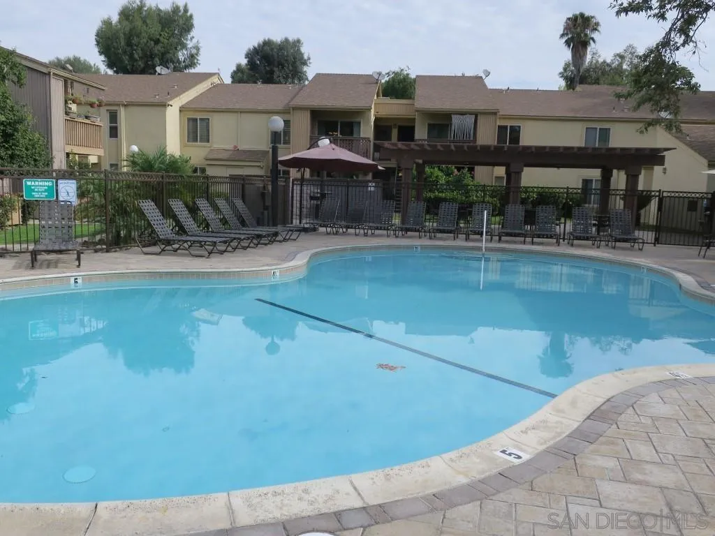 5938 Rancho Mission Road, Unit 134 San Diego, CA 92108 - Photo 27 of 36 a view of a house with swimming pool