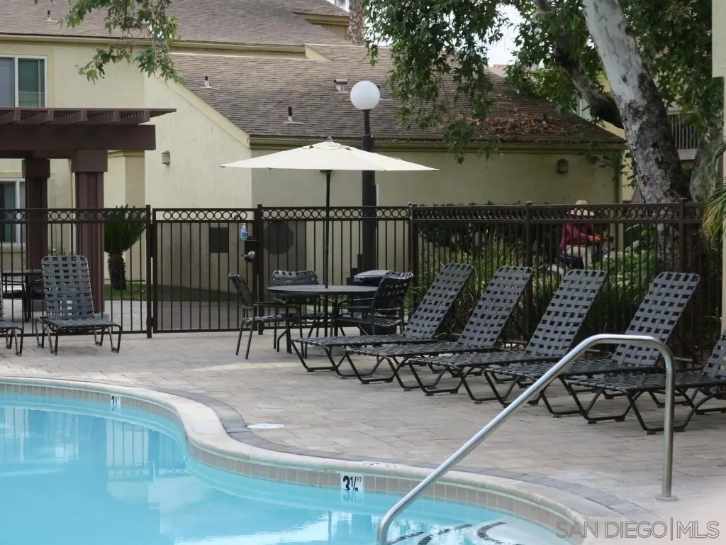 5938 Rancho Mission Road, Unit 134 San Diego, CA 92108 - Photo 28 of 36 a patio with table and chairs