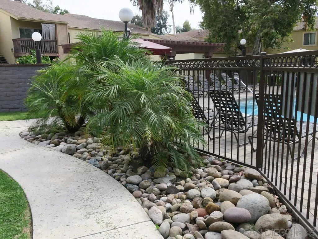 5938 Rancho Mission Road, Unit 134 San Diego, CA 92108 - Photo 32 of 36 a view of street along with wooden fence