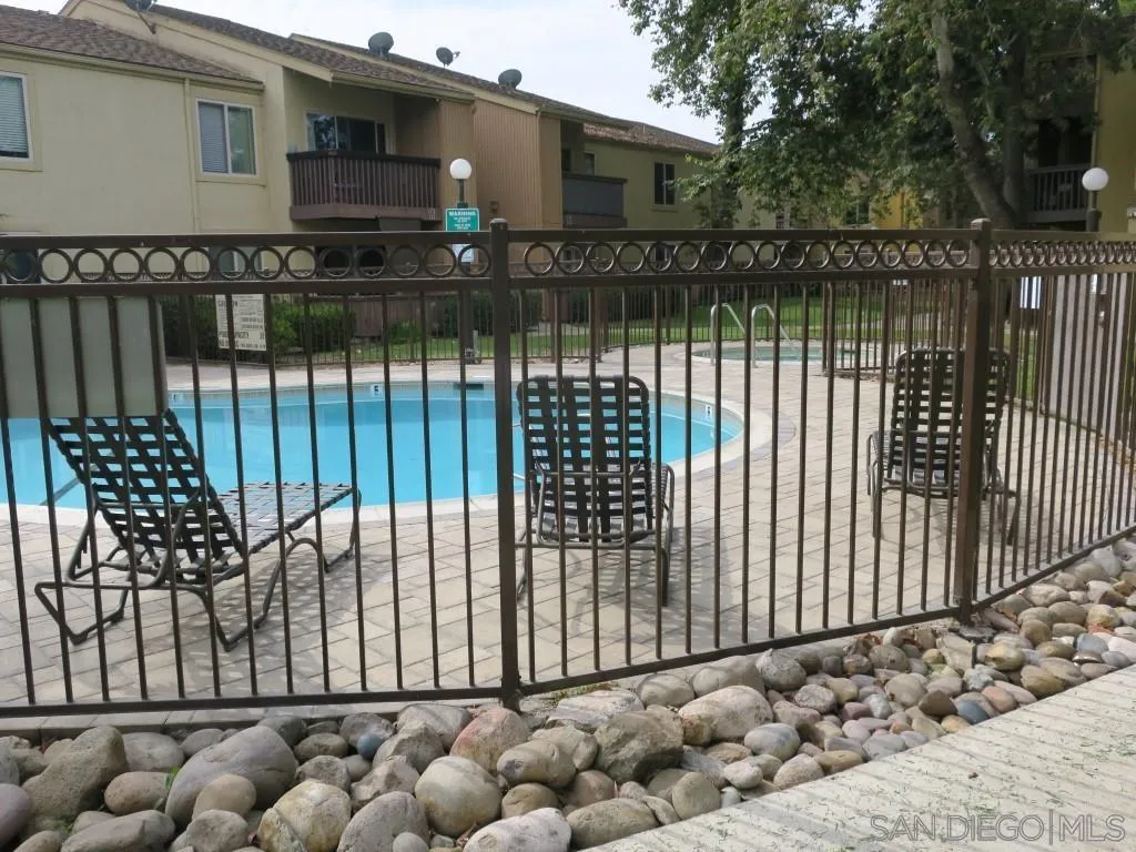 5938 Rancho Mission Road, Unit 134 San Diego, CA 92108 - Photo 33 of 36 a view of a house with backyard