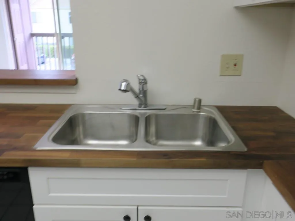 5938 Rancho Mission Road, Unit 134 San Diego, CA 92108 - Photo 4 of 36 a close view of sink and tap