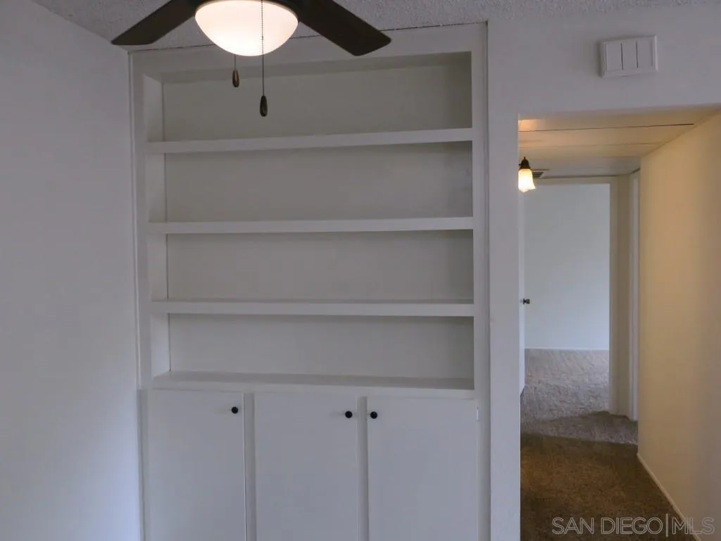 5938 Rancho Mission Road, Unit 134 San Diego, CA 92108 - Photo 5 of 36 a view of a room with rack on the wall