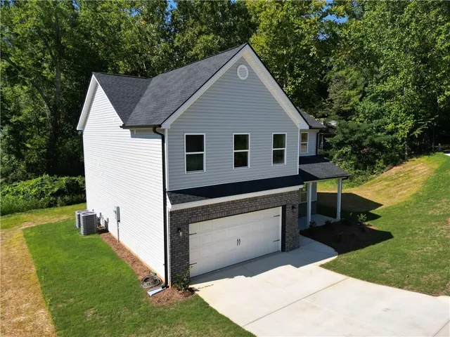 a view of backyard with a garden and deck