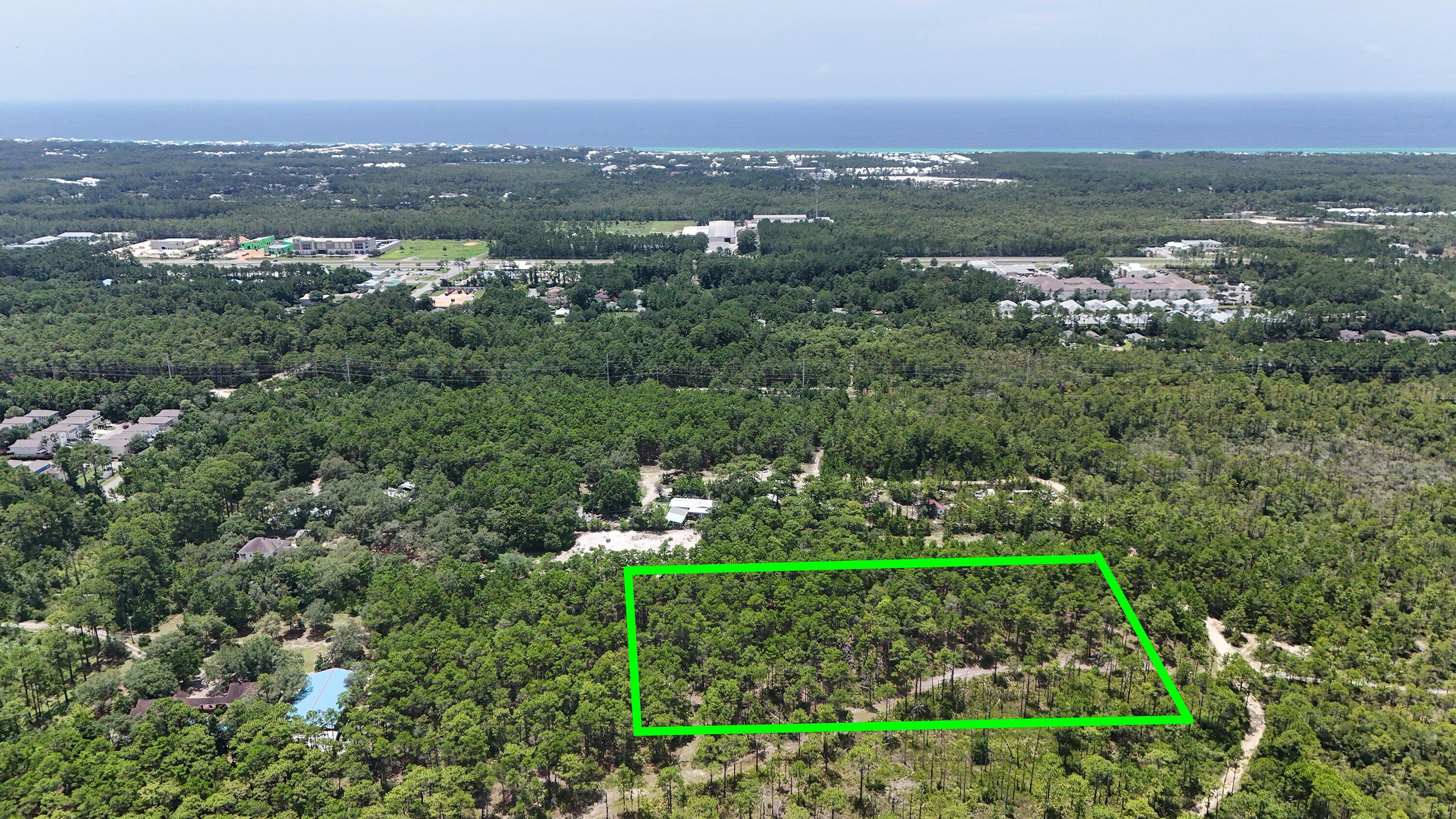 461 Don Bishop Road Santa Rosa Beach, FL 32459 - Photo 8 of 17 a view of a city with lush green forest