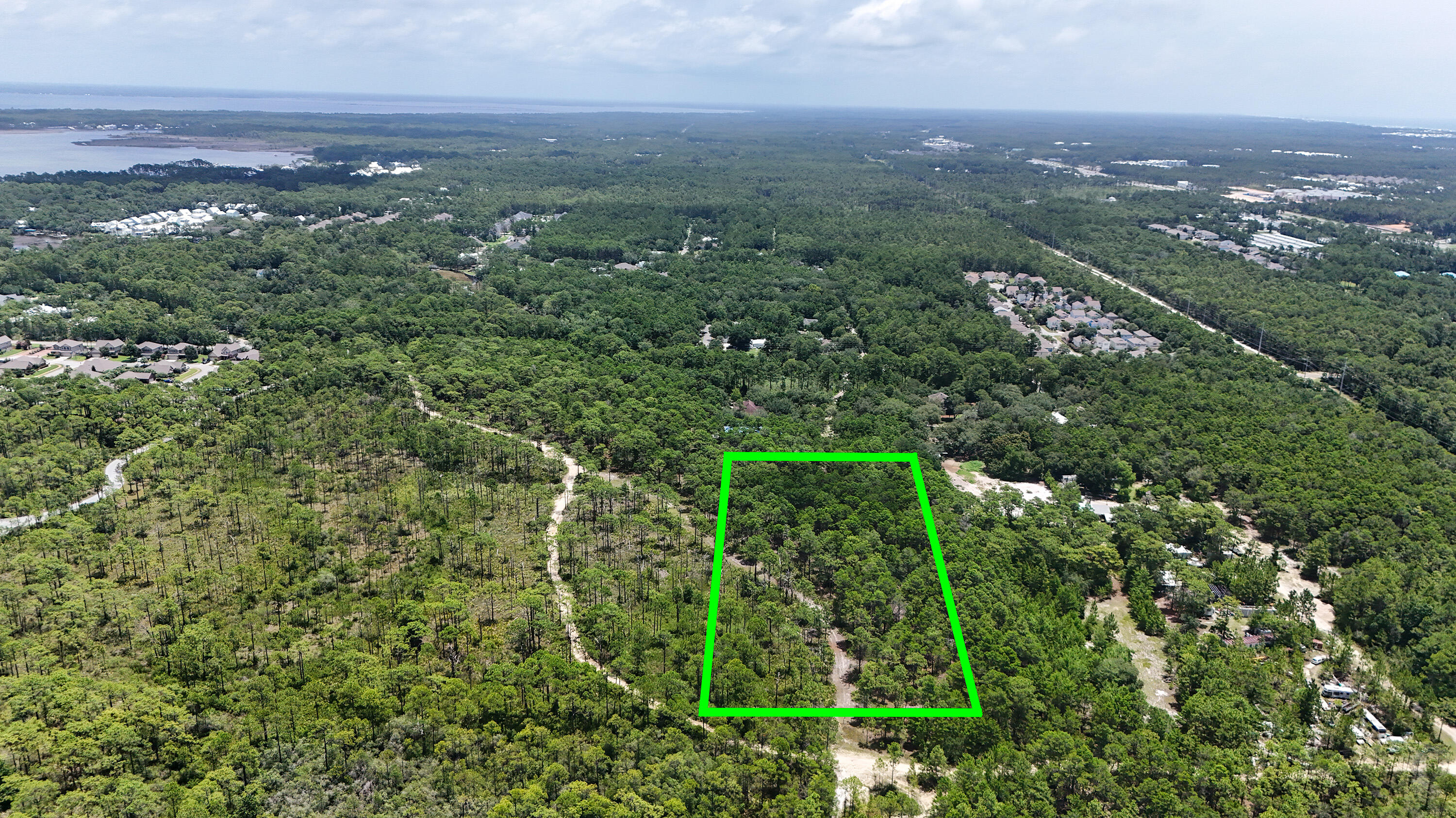 461 Don Bishop Road Santa Rosa Beach, FL 32459 - Photo 9 of 17 an aerial view of residential houses with outdoor space and trees