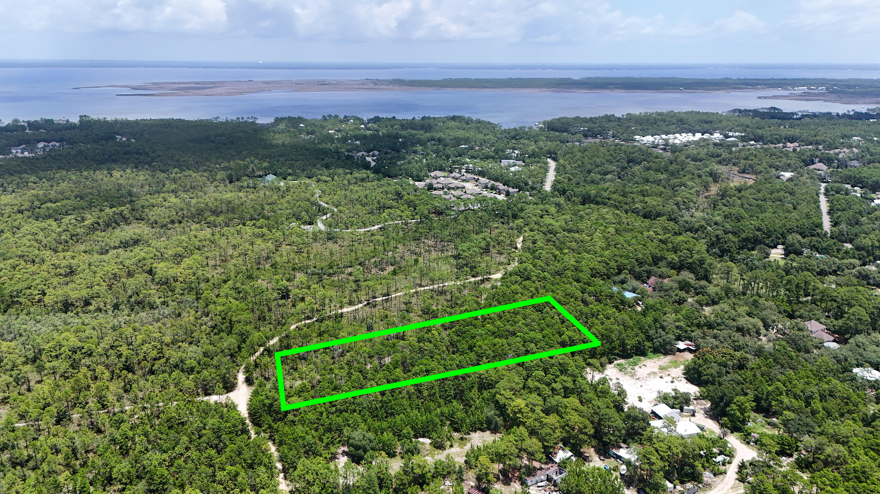 461 Don Bishop Road Santa Rosa Beach, FL 32459 - Photo 10 of 17 a view of a green field with lots of bushes