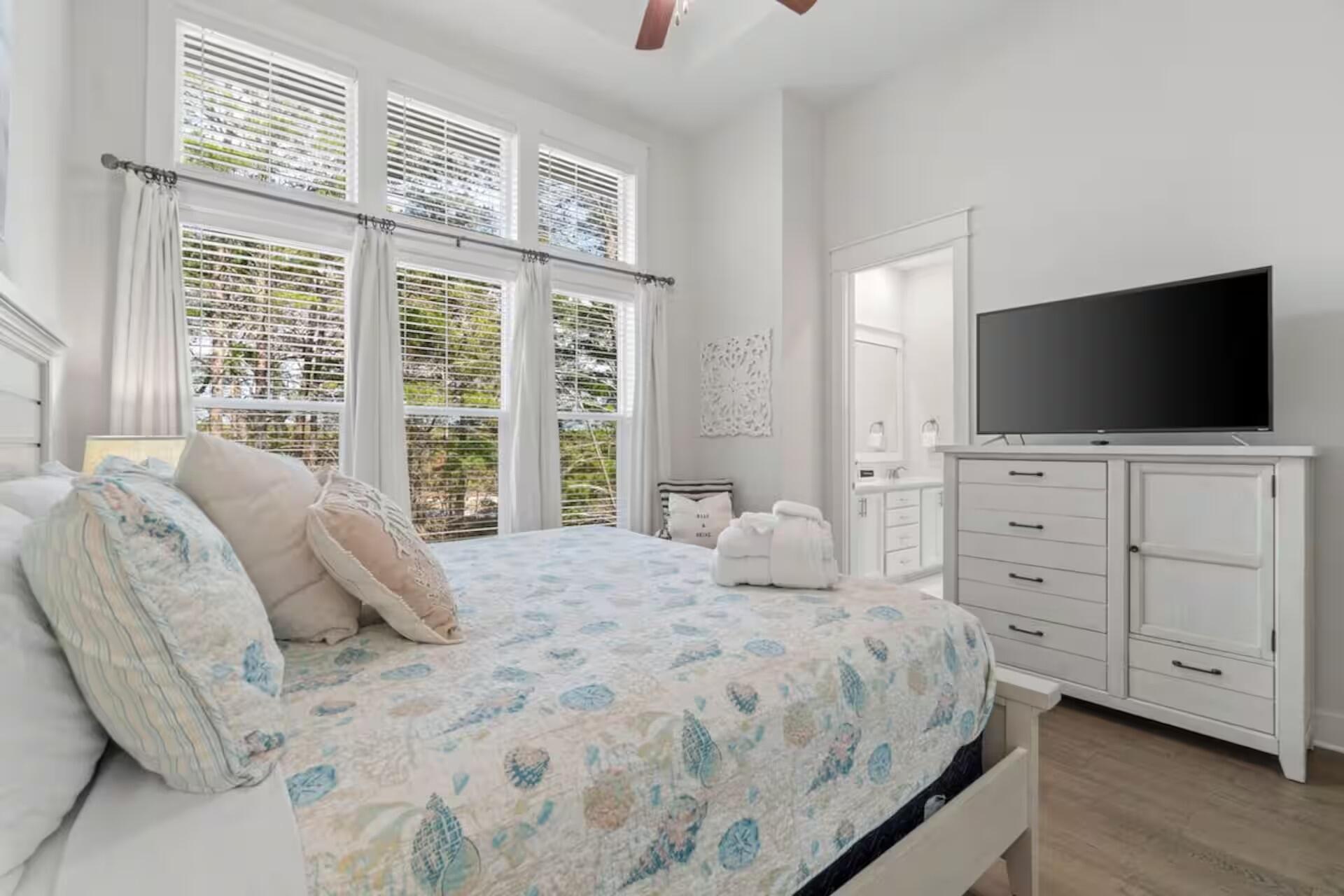 146 East E Pine, Unit B Inlet Beach, FL 32461 - Photo 20 of 47 a bedroom with a bed and a flat screen tv