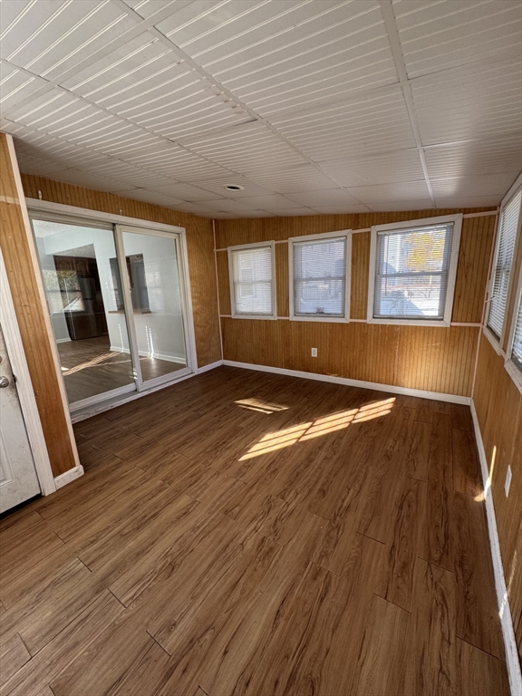 100 Bonney Street New Bedford, MA 02740 - Photo 22 of 23 a view of empty room with wooden floor and fan