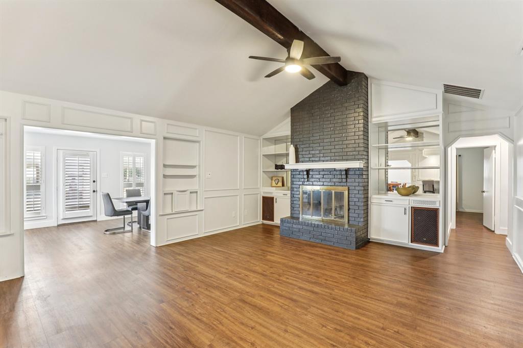 6667 Silver Saddle Road Fort Worth, TX 76126 - Photo 11 of 35 a view of a kitchen with furniture and wooden floor