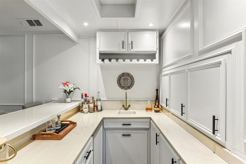 6667 Silver Saddle Road Fort Worth, TX 76126 - Photo 13 of 35 a bathroom with a sink and a mirror
