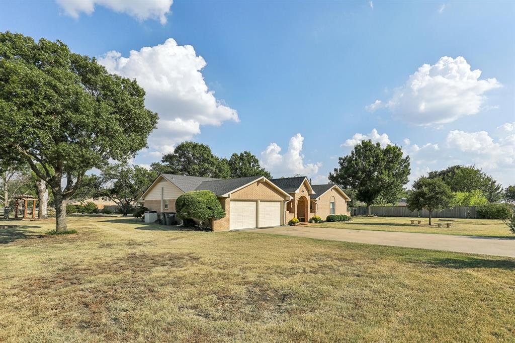 6667 Silver Saddle Road Fort Worth, TX 76126 - Photo 2 of 35 a view of a house with a yard