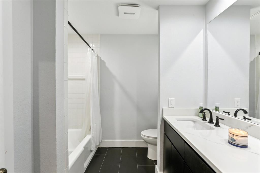 6667 Silver Saddle Road Fort Worth, TX 76126 - Photo 23 of 35 a bathroom with a sink and a mirror