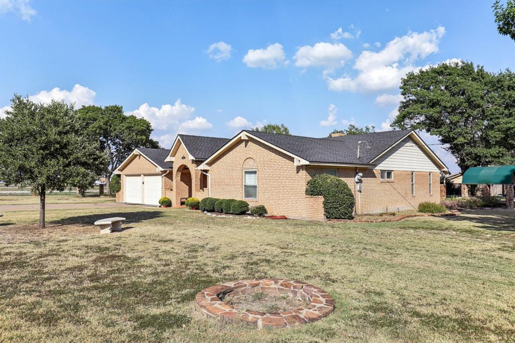 6667 Silver Saddle Road Fort Worth, TX 76126 - Photo 4 of 35 a view of a house with a yard