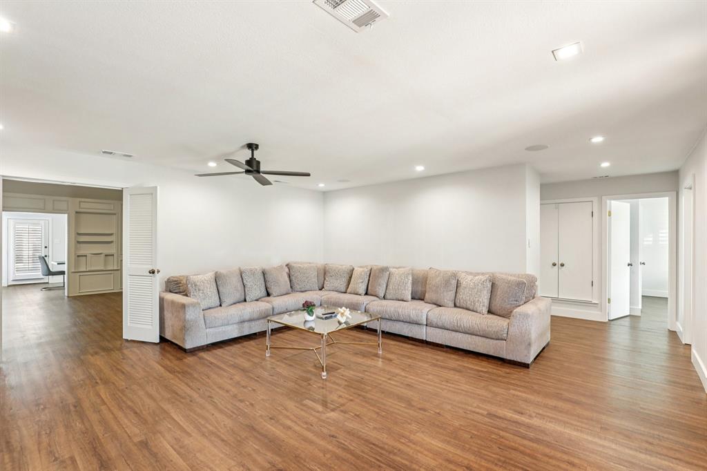 6667 Silver Saddle Road Fort Worth, TX 76126 - Photo 5 of 35 a living room with furniture and a wooden floor