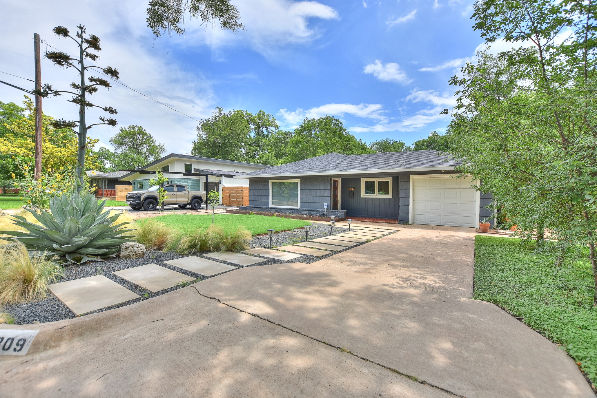 1309 Ridgemont Drive Austin, TX 78723 - Photo 2 of 35 3 bedrooms, 2 full baths PLUS an attached 1 car garage with EV charging capability!