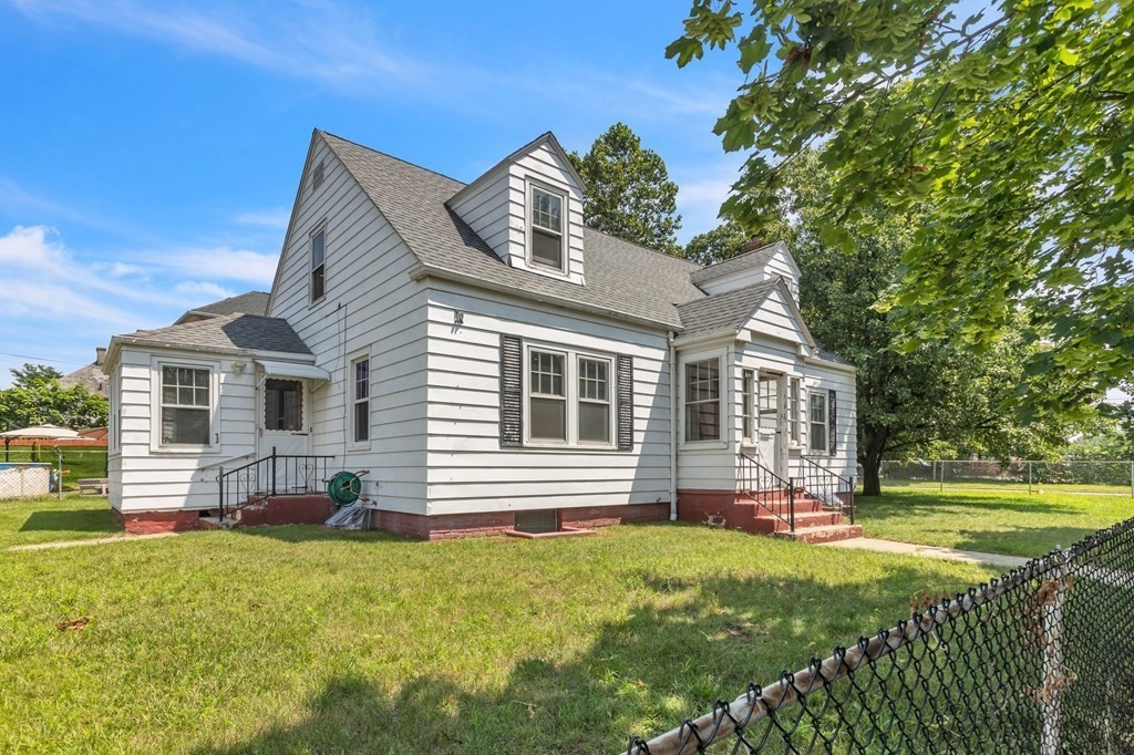 61 Beauregard Street Springfield, MA 01151 - Photo 1 of 24 a front view of house with yard and outdoor seating