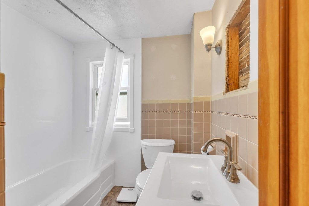 61 Beauregard Street Springfield, MA 01151 - Photo 17 of 24 a bathroom with a sink and a shower