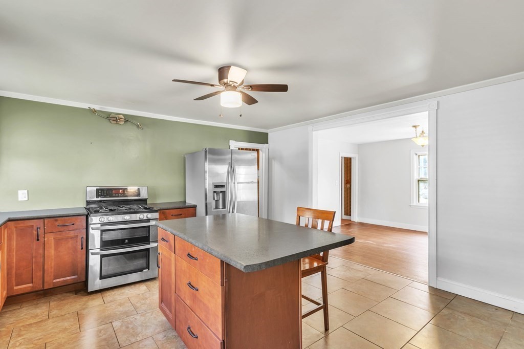 61 Beauregard Street Springfield, MA 01151 - Photo 7 of 24 a kitchen that has a lot of cabinets in it and a sink