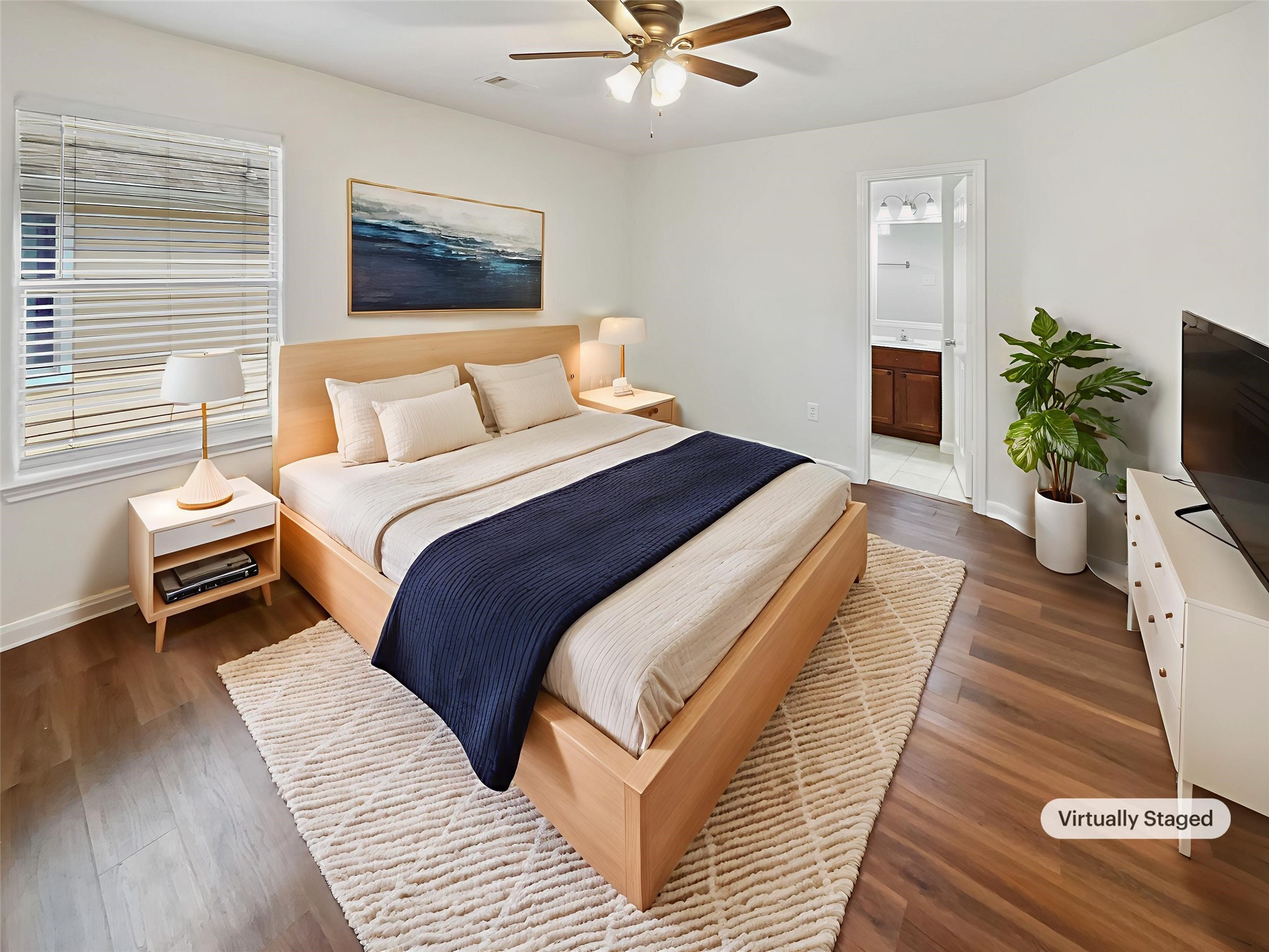 4822 East Fairfax Village Circle Spring, TX 77373 - Photo 13 of 24 a bedroom with bed and a potted plant