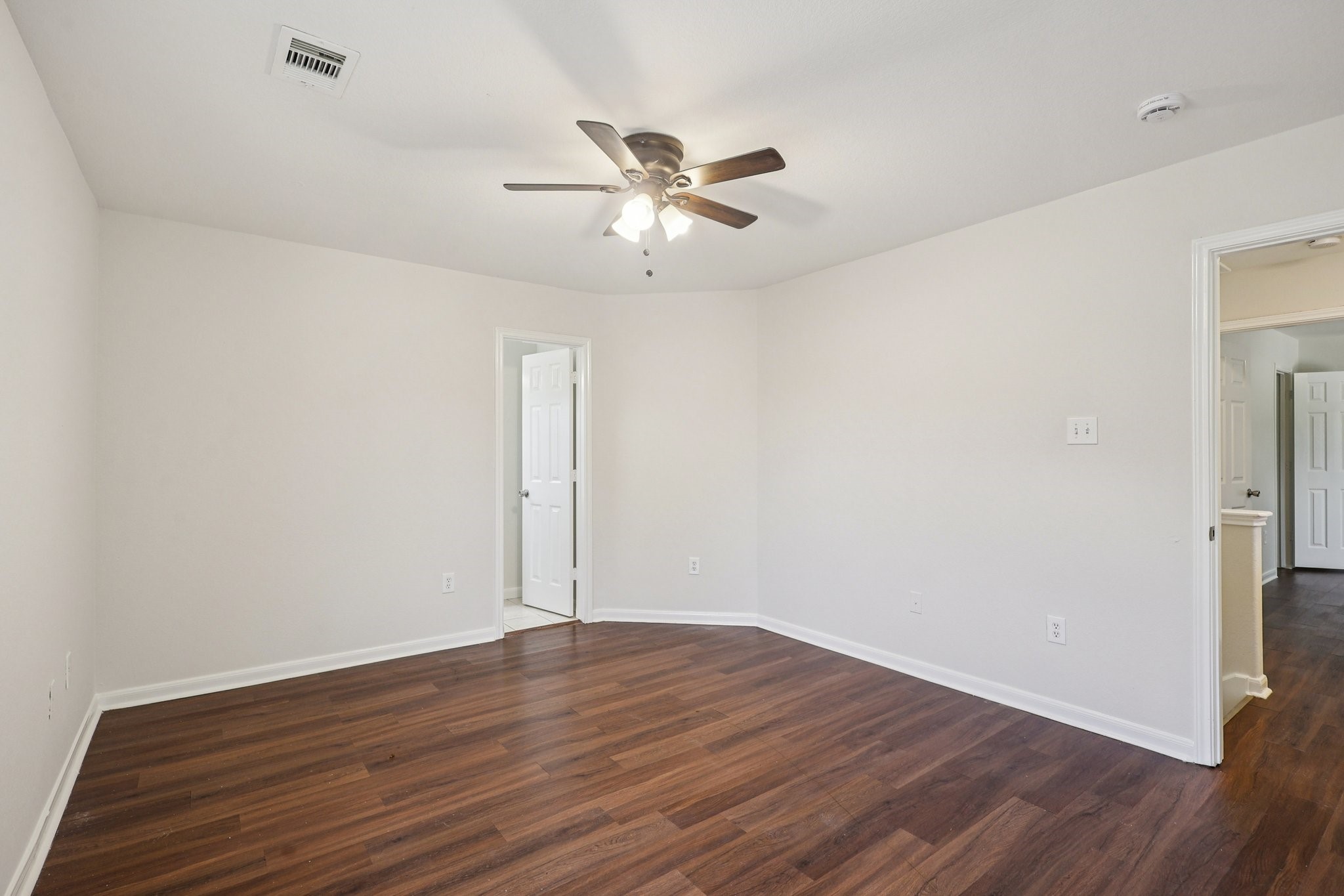 4822 East Fairfax Village Circle Spring, TX 77373 - Photo 14 of 24 a view of an empty room with wooden floor