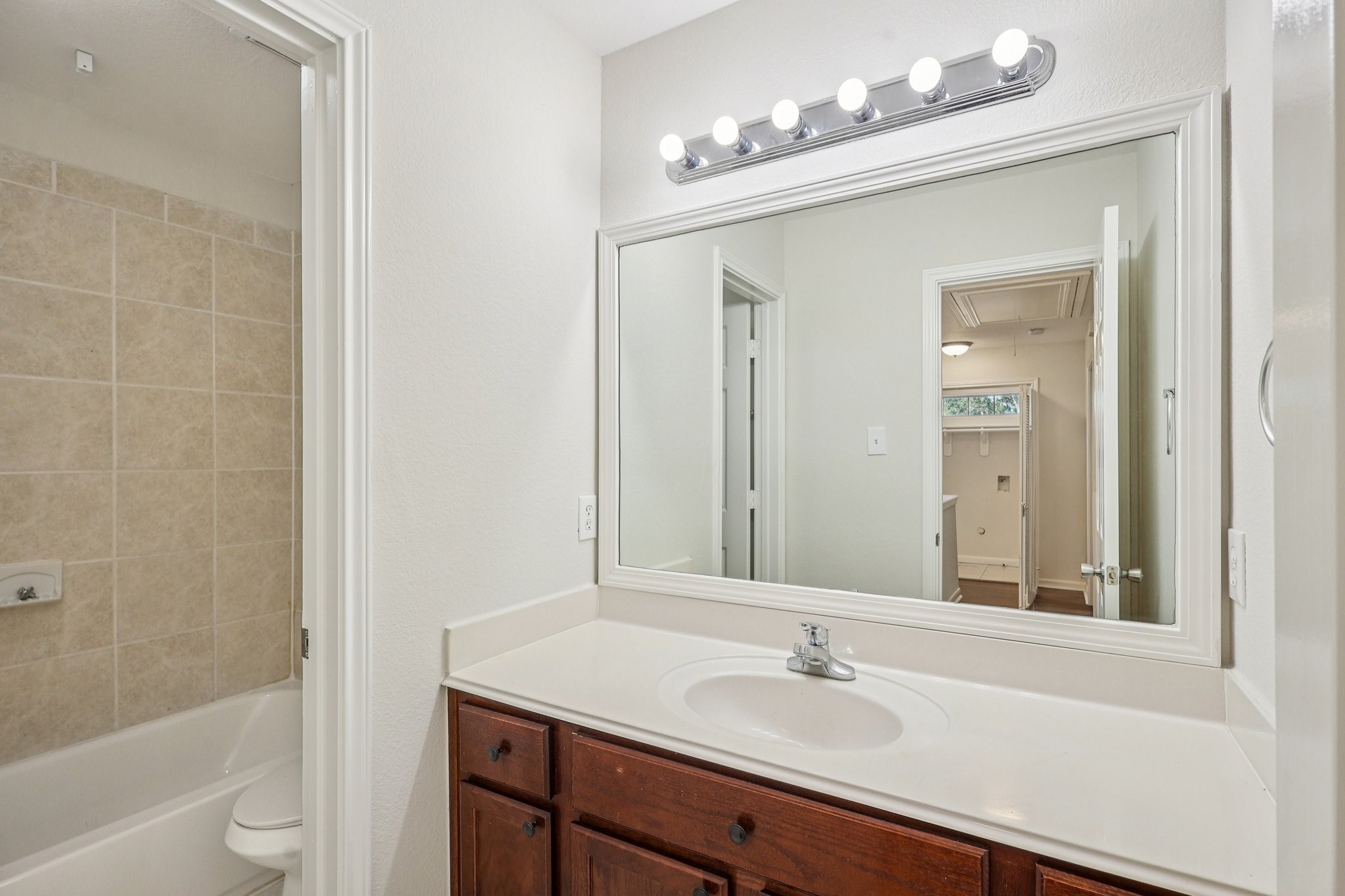 4822 East Fairfax Village Circle Spring, TX 77373 - Photo 18 of 24 a bathroom with a sink a toilet and shower