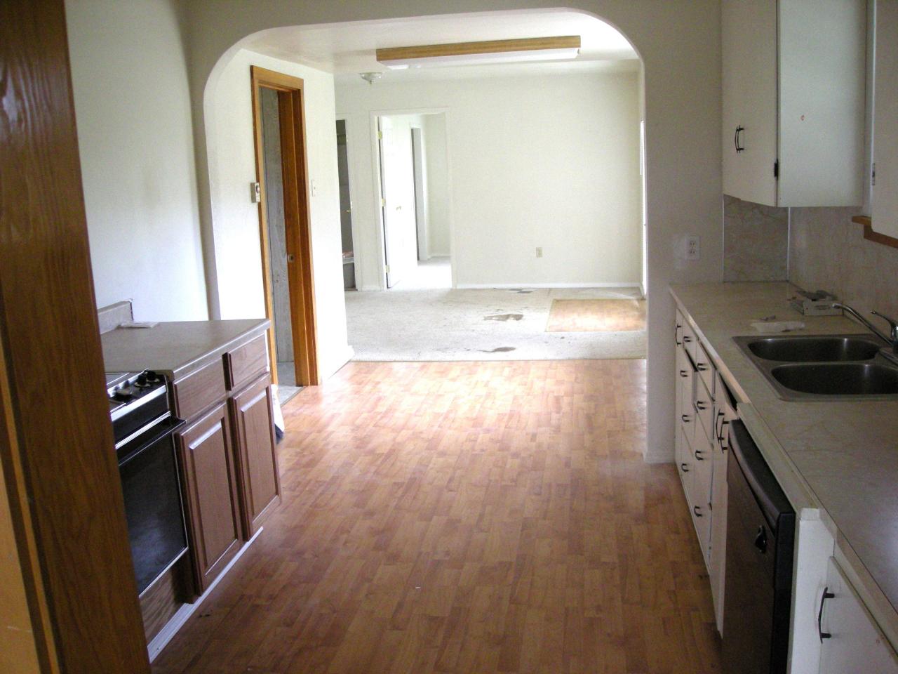 5302 Gamache Road Moxee, WA 98936 - Photo 4 of 7 a kitchen with wooden floors and a sink