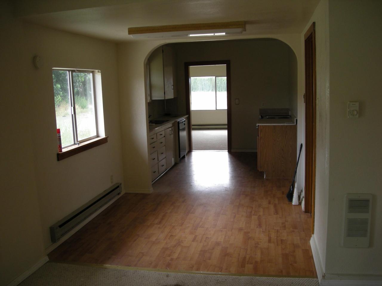5302 Gamache Road Moxee, WA 98936 - Photo 6 of 7 wooden floor in a hall with a window