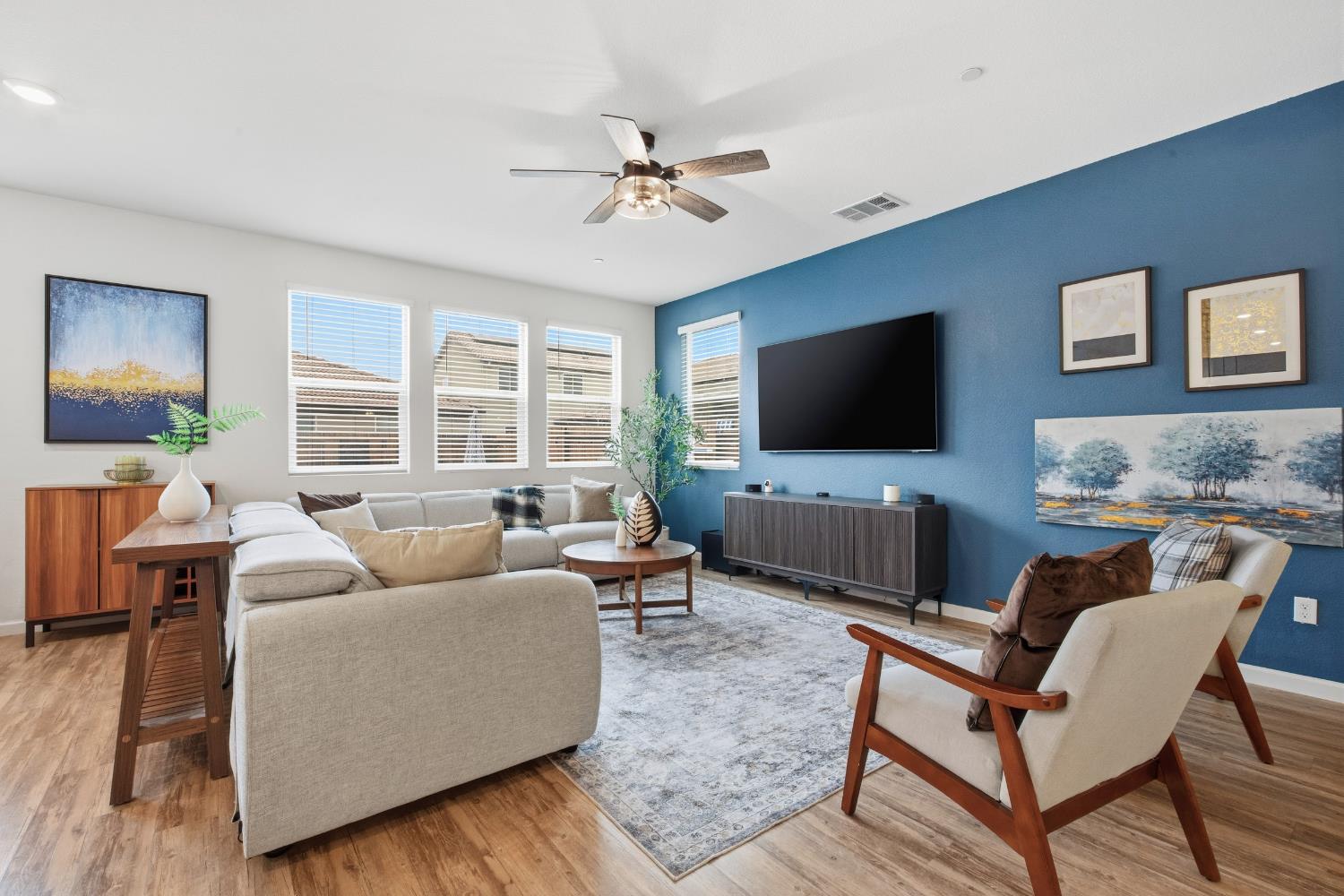 7240 Encore Way Roseville, CA 95747 - Photo 17 of 52 a living room with furniture and a flat screen tv