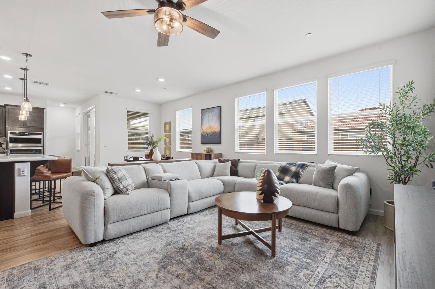 7240 Encore Way Roseville, CA 95747 - Photo 18 of 52 a living room with furniture and a large window