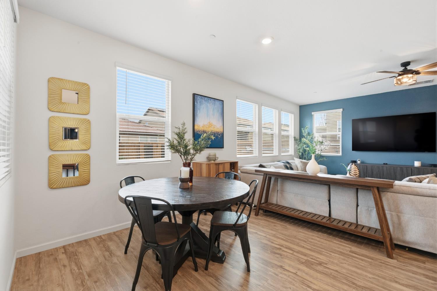 7240 Encore Way Roseville, CA 95747 - Photo 21 of 52 a view of a dining room with furniture window and wooden floor