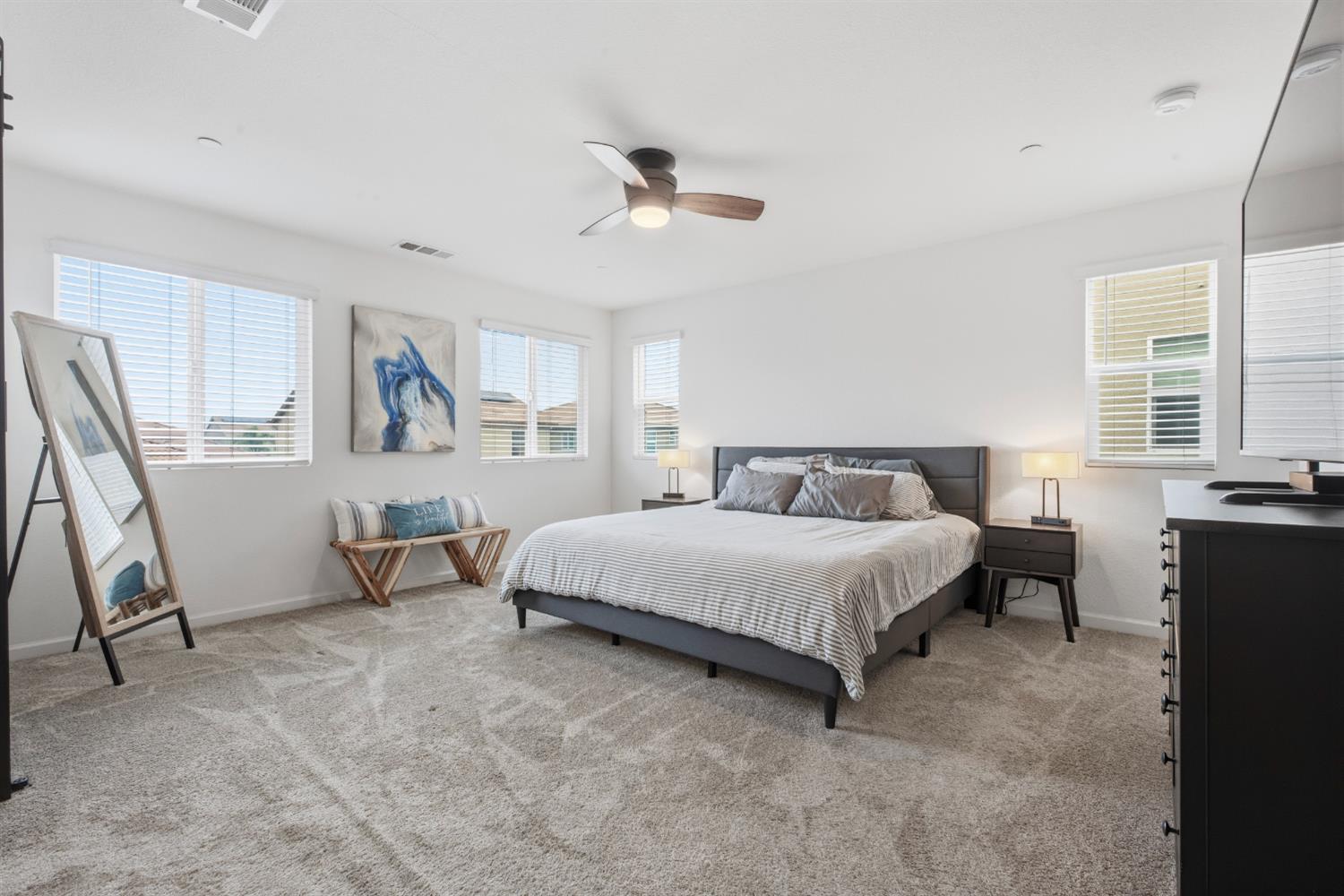 7240 Encore Way Roseville, CA 95747 - Photo 26 of 52 a bed room with a bed and a chair