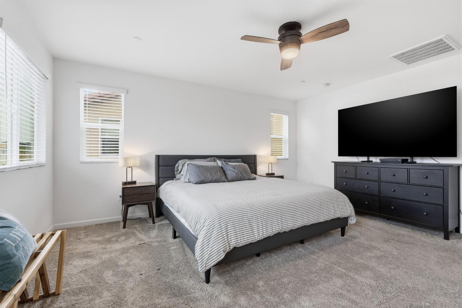 7240 Encore Way Roseville, CA 95747 - Photo 27 of 52 a bedroom with a bed and a flat screen tv on dresser
