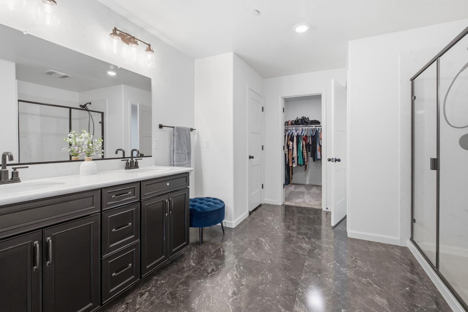 7240 Encore Way Roseville, CA 95747 - Photo 30 of 52 a bathroom with a sink a vanity and a mirror