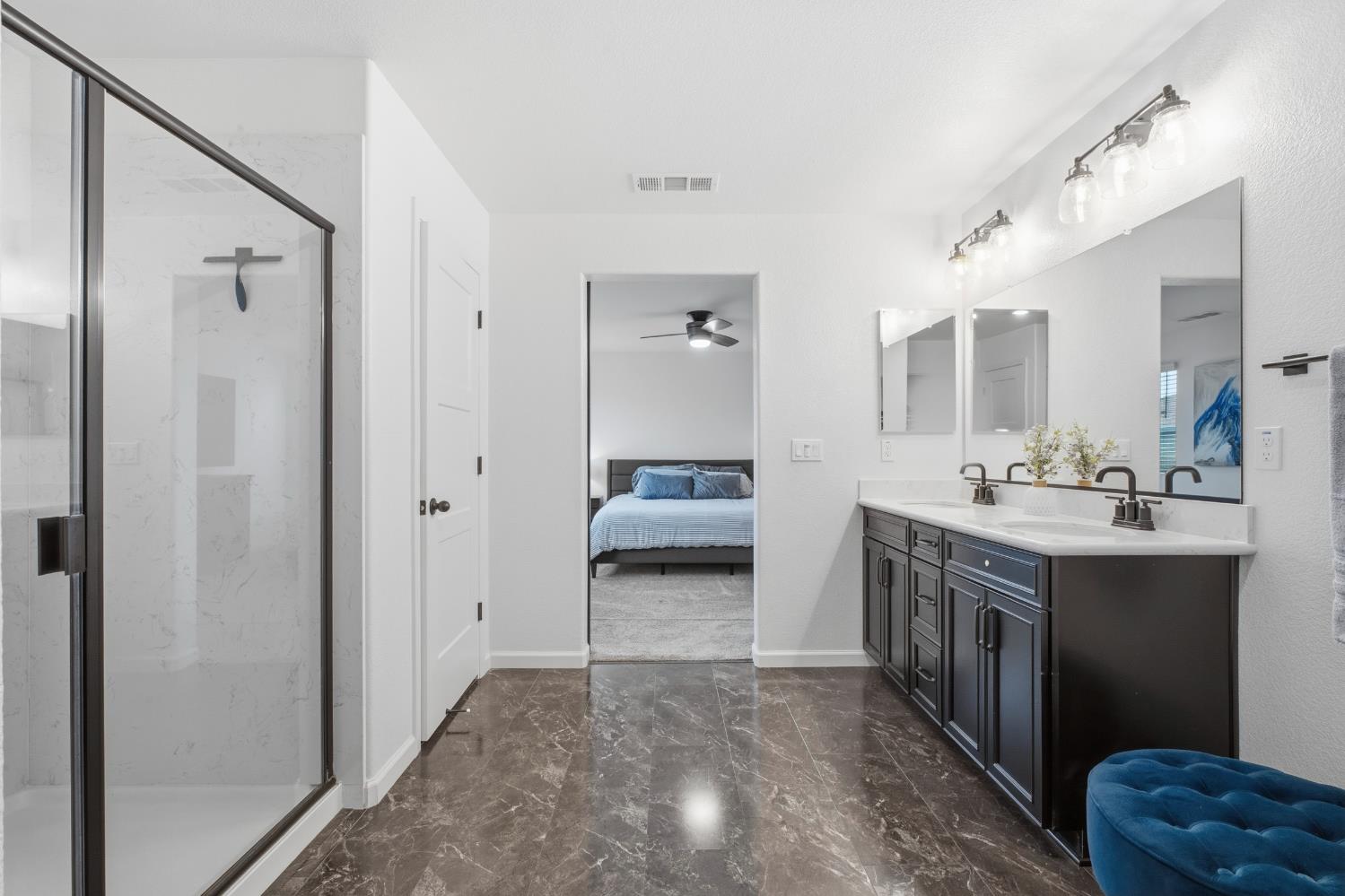7240 Encore Way Roseville, CA 95747 - Photo 31 of 52 a en suite bathroom with a sink double vanity and a mirror