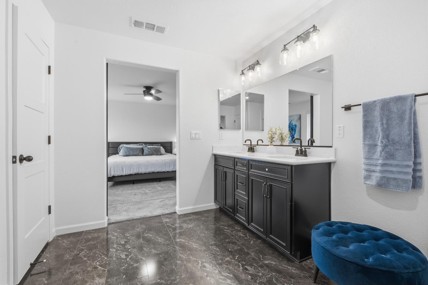 7240 Encore Way Roseville, CA 95747 - Photo 32 of 52 a en suite bathroom with a toilet a sink and mirror