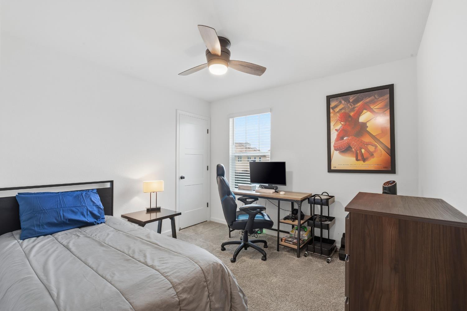 7240 Encore Way Roseville, CA 95747 - Photo 34 of 52 a bedroom with a bed and a desk