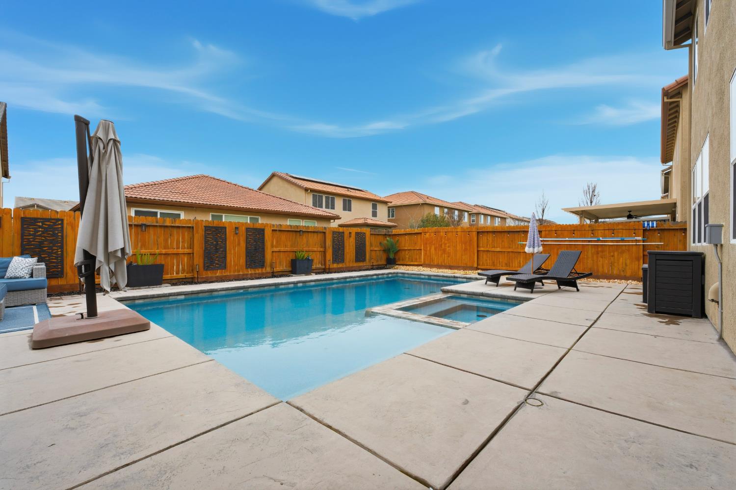 7240 Encore Way Roseville, CA 95747 - Photo 42 of 52 a front view of a house with swimming pool